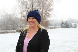 Model Wearing Adult Acrylic Ribbed Cuff with Matching Pom in Navy