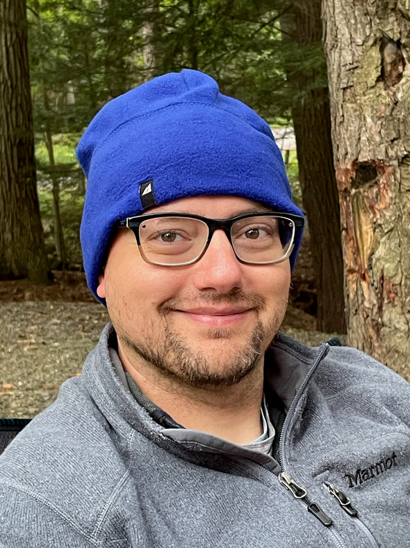 Model Wearing Adult Fleece Cap in Blue