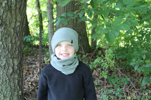 Model Wearing Child Fleece Cap and Gaiter Set in Green