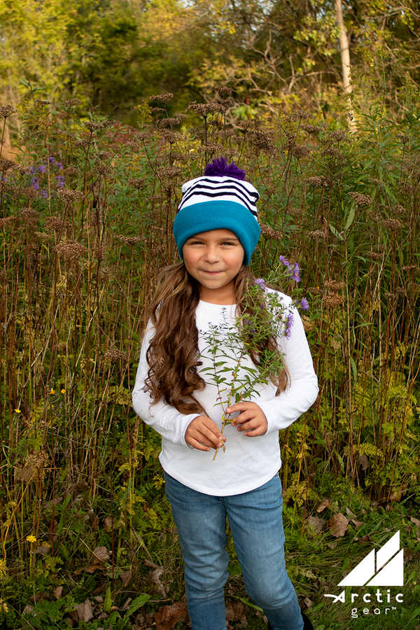 Model Wearing Child Specialty Hat in Teal and Purple Chevron with Pom