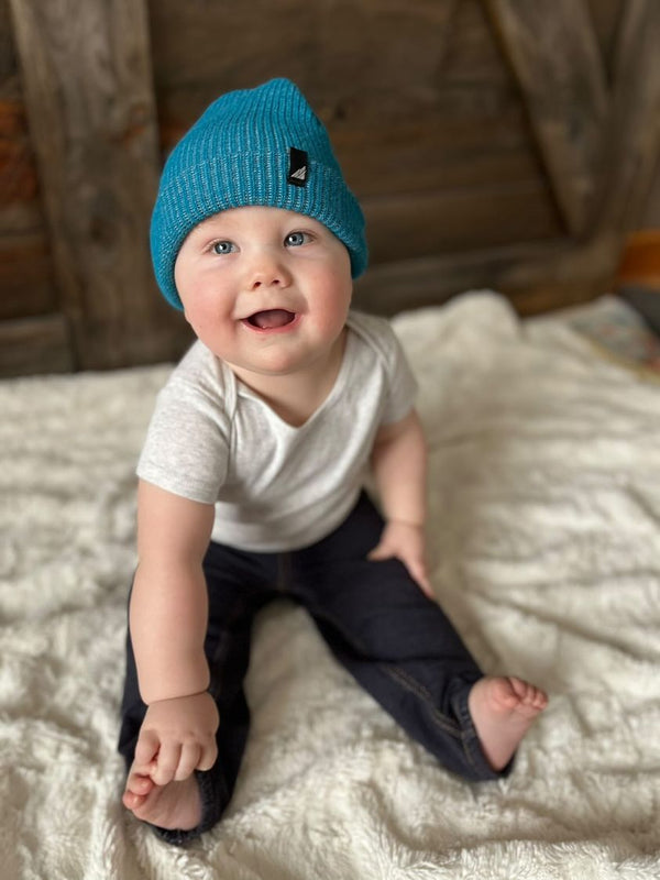 Model Wearing Infant Acrylic Cuff in Blue and Gray