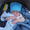 Model Wearing Newborn Acrylic Cuff in Baby Blue