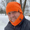 Model Wearing Adult Fleece Neck Gaiter in Neon Orange