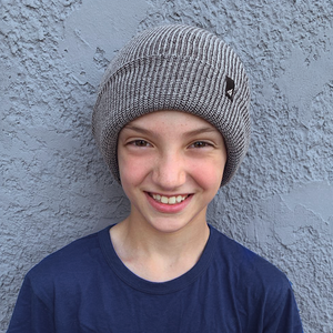 Model Wearing Child Acrylic Cuff in Gray and Black