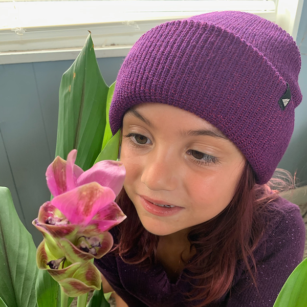 Model Wearing Child Acrylic Cuff in Plum and Purple